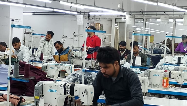 a group of people working on sewing machines