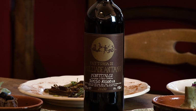 San Gemini, Il giardino - Vino e cucina - a bottle of wine on a table with a bottle of wine