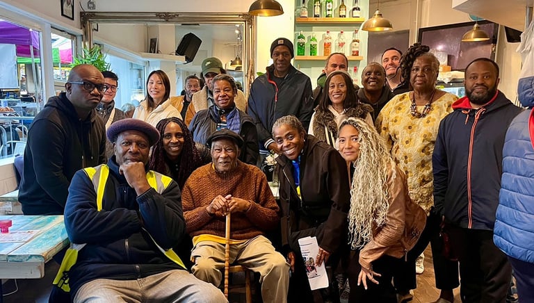 a group of people with Leslie Palmer