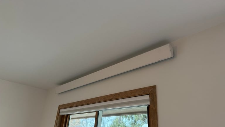 indoor overhead heater above a wooden framed window