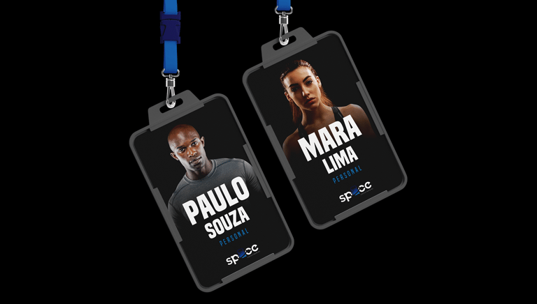 a pair of business badges on a black background with the visual identity of space crosstraining