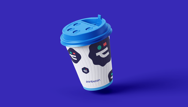 personalized coffee cup with Pontecon's visual identity on a blue background