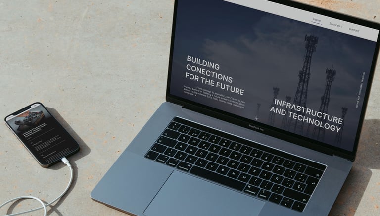 a laptop computer and a cell phone on a table