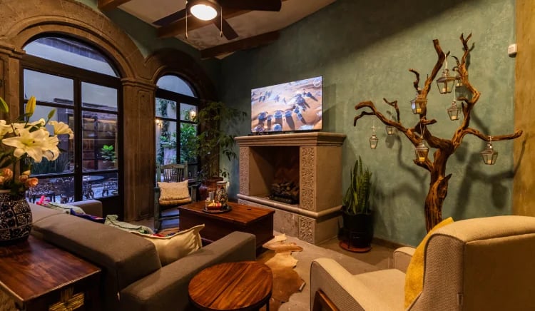 living room with fireplace in san miguel de allende