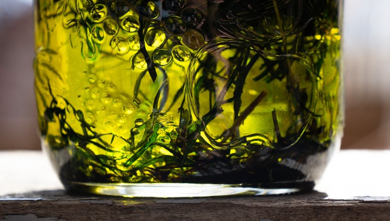 a jar with herbs sitting in oil