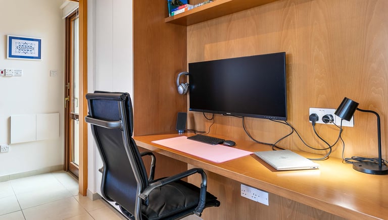 Work-from-home desk with large screen at Theseus Retreat holiday rental in Cyprus