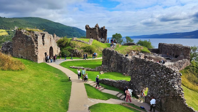 Loch Ness lies beyond Urquhart Castle in Scotland