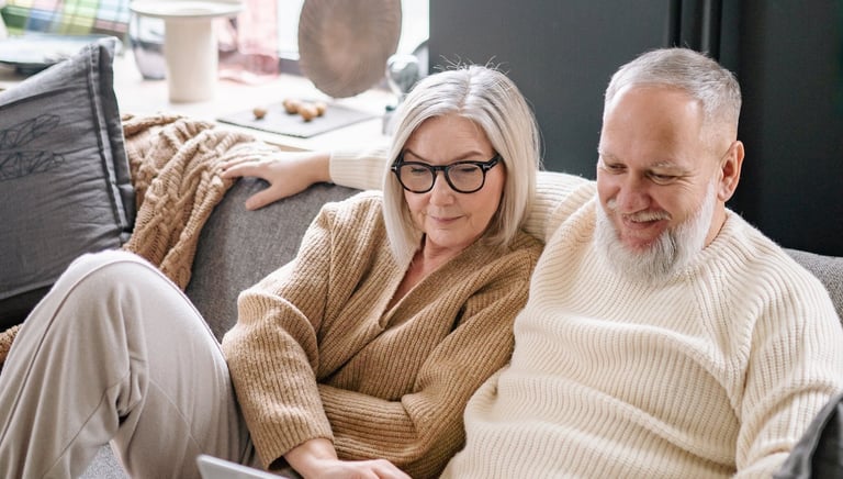 a man and woman sitting on a couch