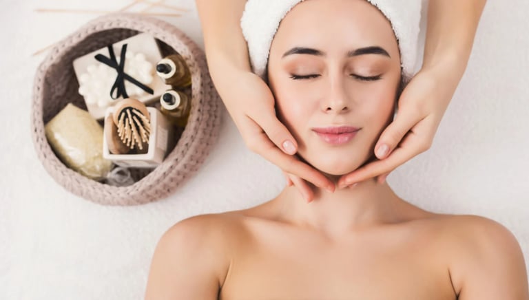 a woman getting a facial massage at a spa