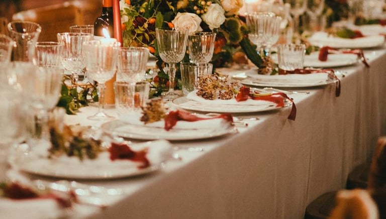a table with a long table set for a wedding