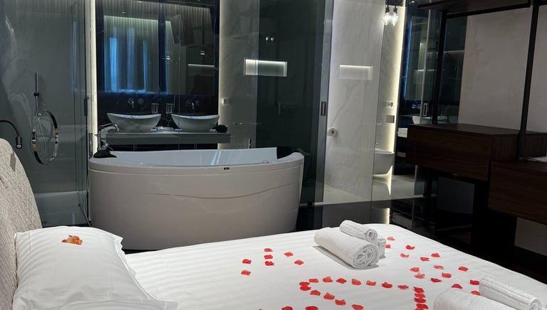 a bed with a large bed and a bathtub