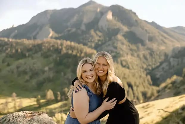Couple posing during scenic mountain photoshoot in Boulder Colorado with Flatirons backdrop