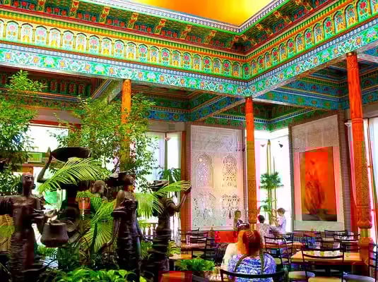 Colorful ice cream parlor in Boulder Colorado with customers enjoying artisan treats after e-bike tour