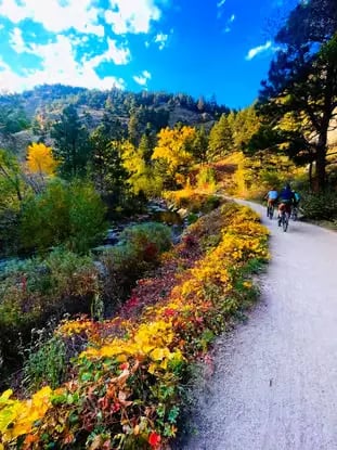 Scenic e-bike path through autumn trees leading to Eldorado Canyon State Park Boulder