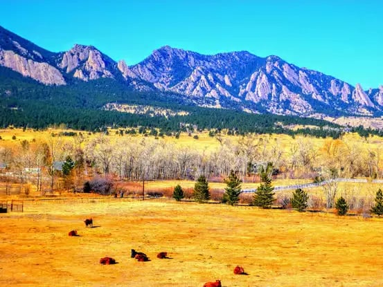 Wide panoramic view of Flatirons mountains from Chautauqua Park Boulder Colorado
