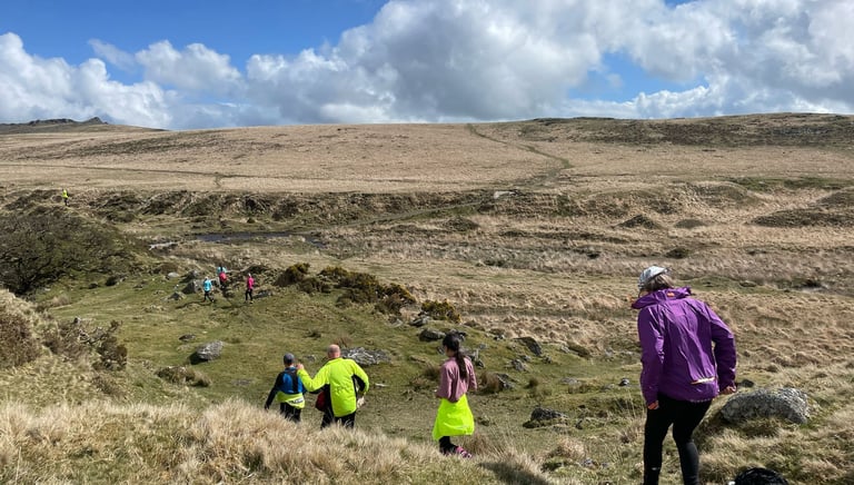 A group of runners running across Dartmoor