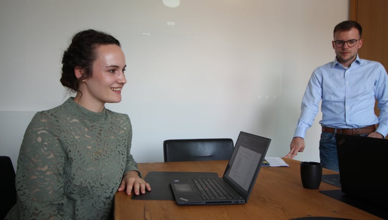 Business professionals collaborating in an office during a funding meeting.