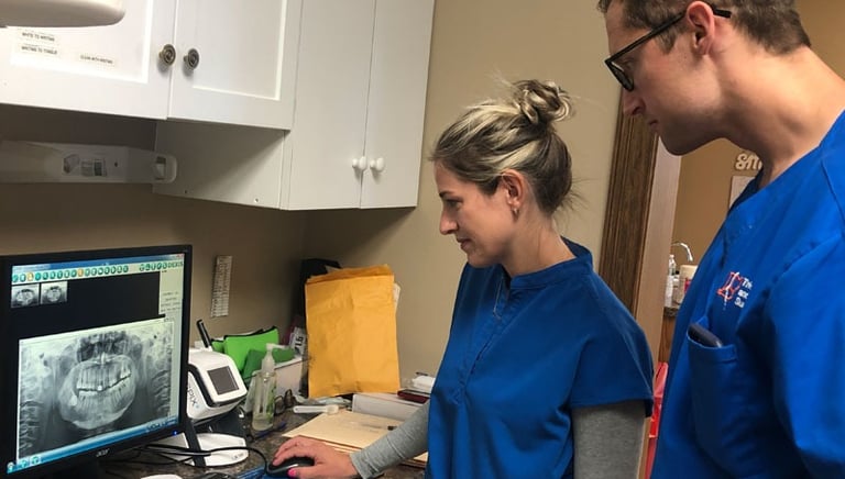 Our dental team reviewing x-rays of a patient's teeth