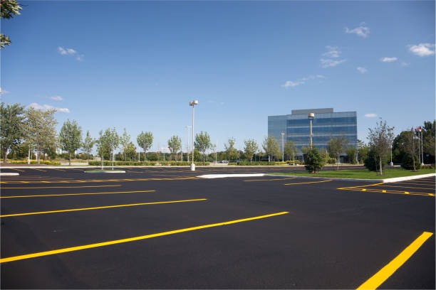Painting parking lot with a trueline parking lot paint line marking striping machine
