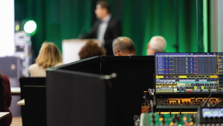 Conference audio mixing console in use during a live corporate presentation in Dubai, managed by Sonus