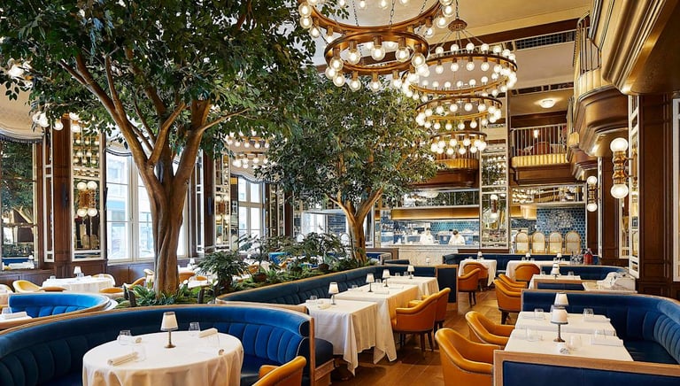 Elegant restaurant at The Fifth Avenue Hotel NYC with lush interiors and luxury dining ambiance.