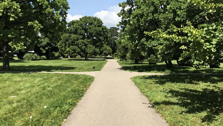 A peaceful park path with two people walking and talking