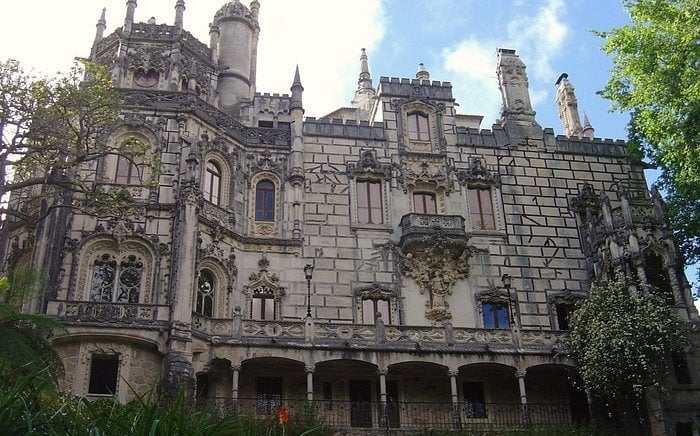 The ornate Neo-Manueline architecture of the Quinta da Regaleira palace in Sintra, Portugal.
