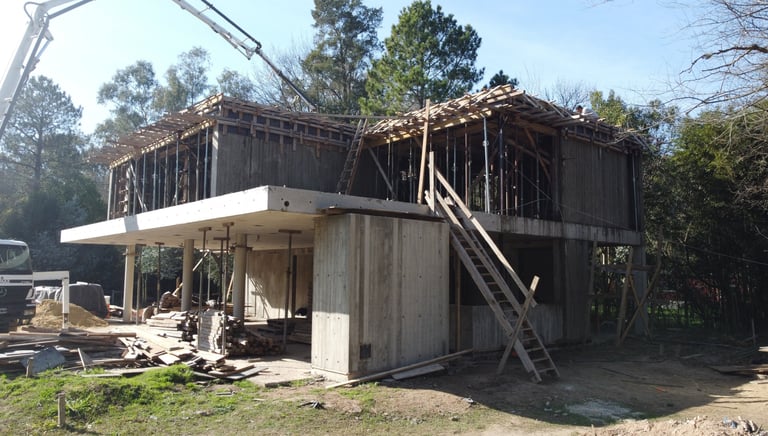 a house being built into a house with a ladder