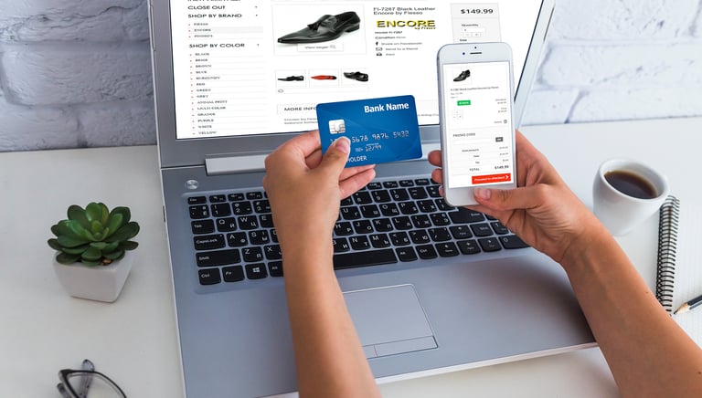 a person holding a credit card and a credit card