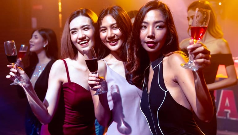 Group of women enjoying drinks at a Las Vegas nightclub during a club crawl event.