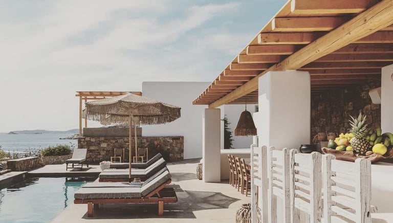 a pool with lounge chairs and a bar