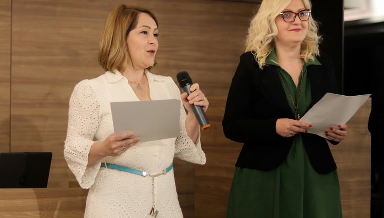 Women business leaders presenting at a team-building retreat.