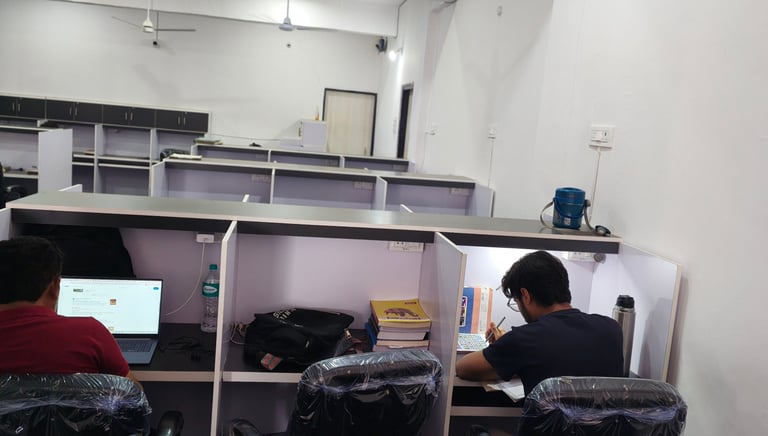 Students studying at Aura Library Bhopal with Comfortable study desks and chairs