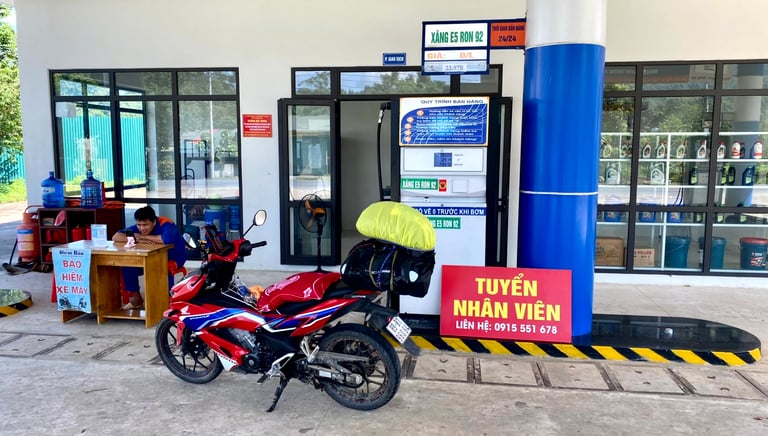 a motorcycle parked in front of a gas station