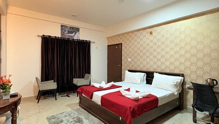 a bedroom with a bed and a desk