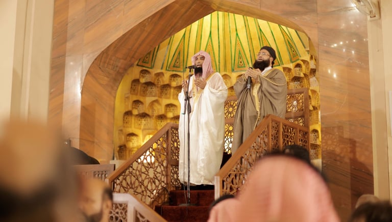a man and woman singing into a microphone