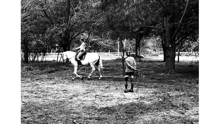 a man riding a horse in a field