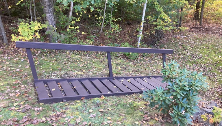 a bench with a bench and a bench in the grass