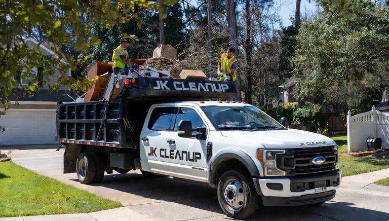 Junk removal in action — Ford F-550 dump truck being loaded in Fredericksburg, Stafford, and Spotsyl