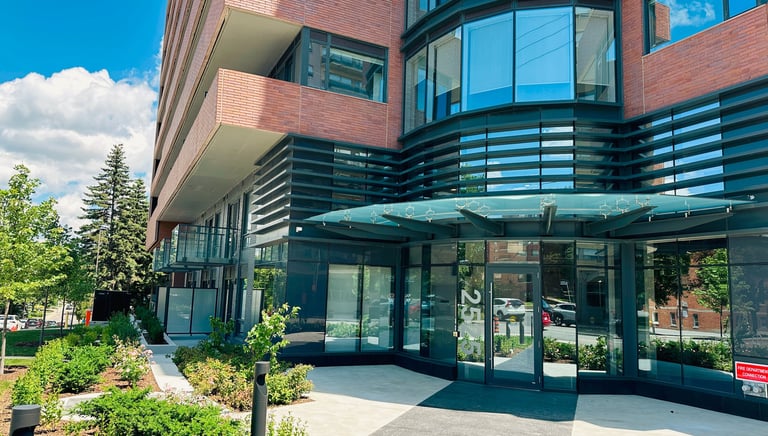 a large building with a bench and a bench in front of it