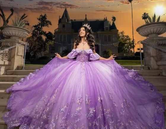 Quinceañera photo booth rental with pink and gold themed backdrop