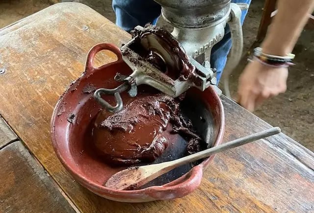 a person is using a grinder in a bowl