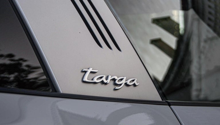 an Enlab Porsche car with a targa tag on the side of it