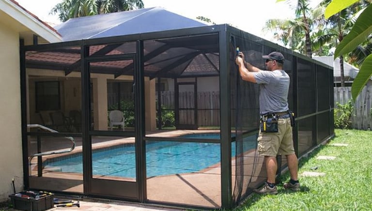 Pool screen enclosure being repaired