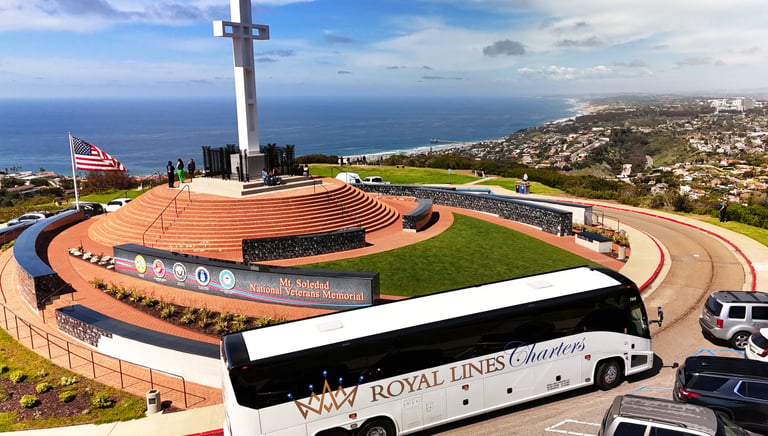 A Royal Lines Charters tour bus parked at the Mt. Soledad National Veterans Memorial in La Jolla.