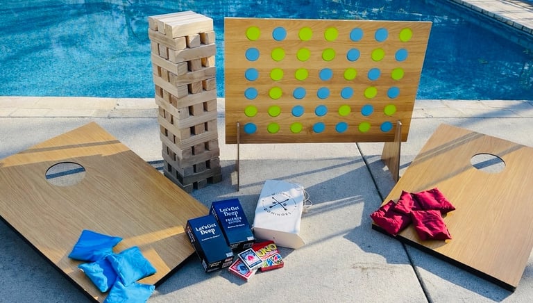 Games Package from Gathered Grace Picnic Co. Jumbo connect four, giant jenga, cornhole, cards