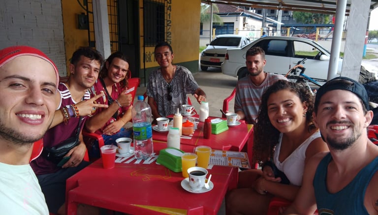 a group of people sitting at a table with drinks