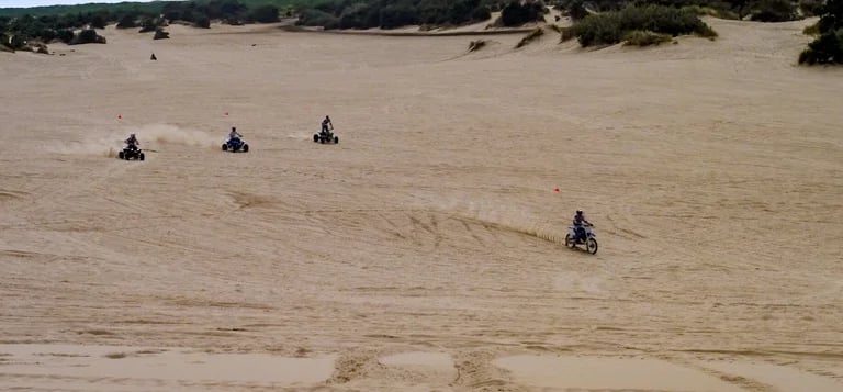 Oregon Coast -People on atv's & motorcycles on Winchester Bay's sand dunes