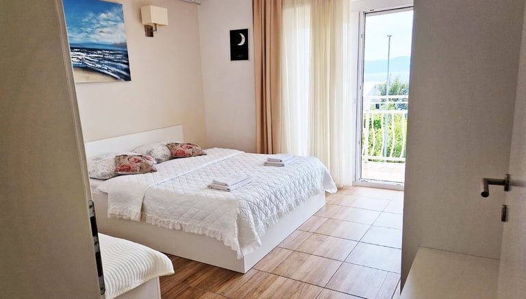 room with a bed, cabinet and windows