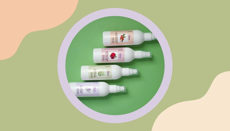 a group of three bottles of tontes and cleansers on a green and white background